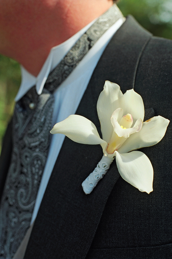 orchid boutonniere with eyelet fabric