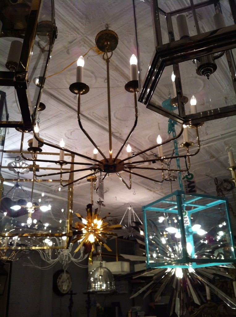 Love the mod brass-armed chandelier as well as the turquoise lantern.