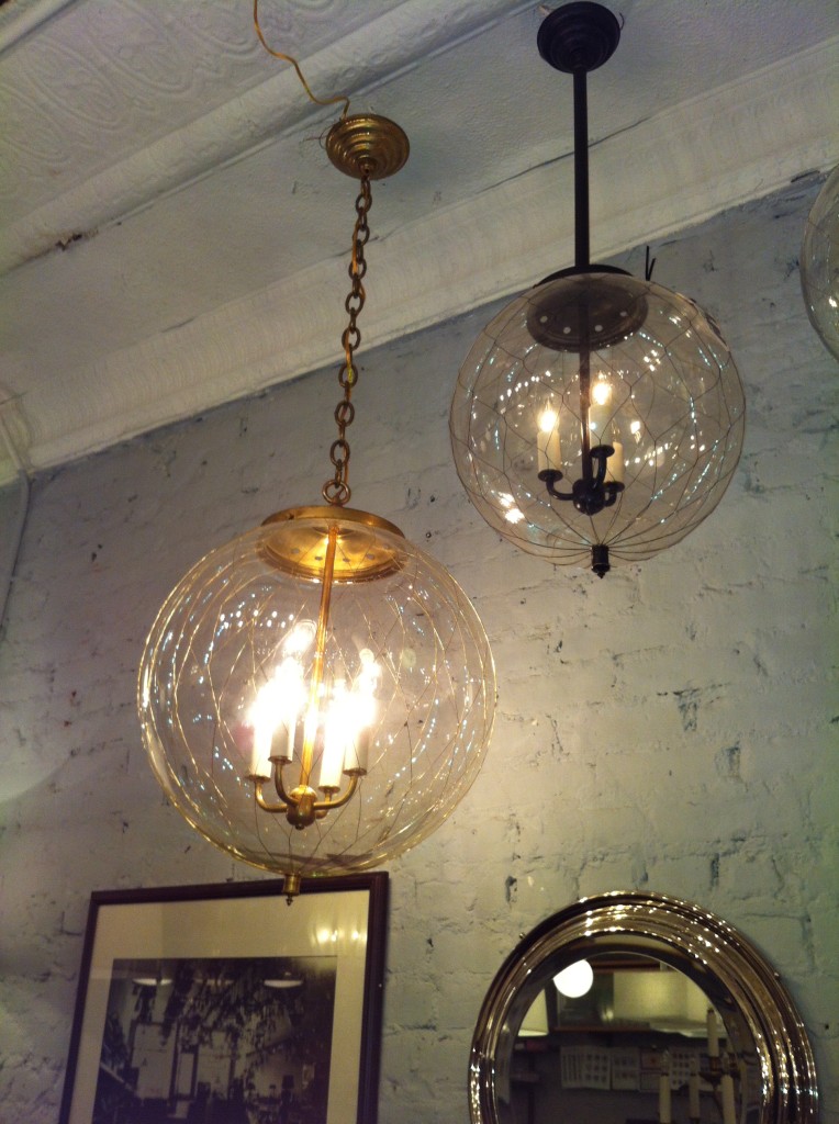 Gorgeous handblown glass globes with wire from Remains Lighting.